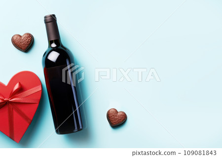 Valentine's day card with red wine, romantic red roses flowers. Generative AI 109081843