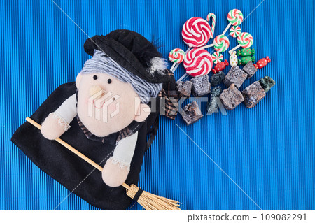 The Befana with sweet coal and candy. Italian Epiphany day tradition. 109082291