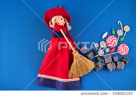 The Befana with sweet coal and candy. Italian Epiphany day tradition. The Befana with sweet coal and candy. Italian Epiphany day tradition. 109082293
