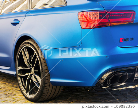 rear close-up view of audi quattro rs6 car muffler and tail lights 109082350