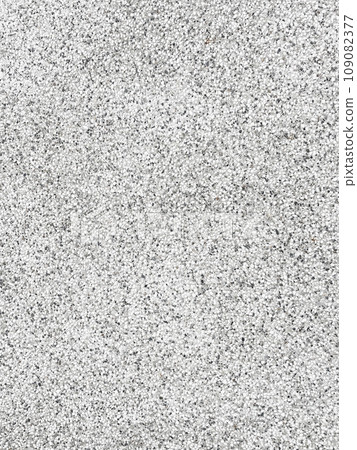 Vertical background image 4 of the surface of washed concrete pavement with white, black, and gray pebbles standing out. 109082377