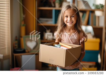 Donation concept - young girl holds box of donations Donation concept - young girl holds box of donations 109083280