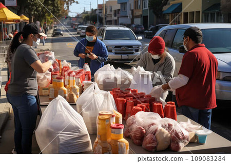 Food drive concept - volunteers accept food donations at food drive 109083284