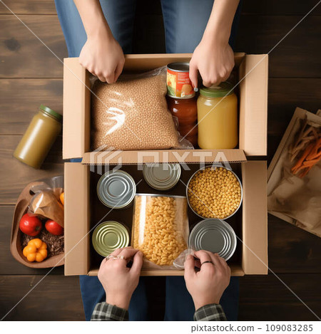Food drive concept - diverse group of volunteers distributes food among less fortunate 109083285