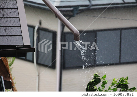 Rain gutter downspouts that are likely to be blown away by a typhoon 109083981