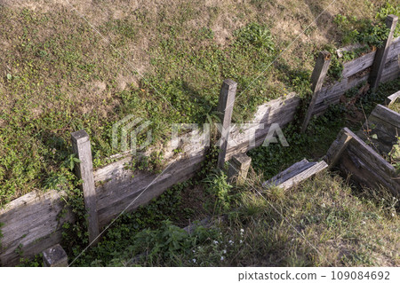 an old abandoned military trench used for defensive actions 109084692