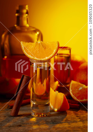 Orange liquor with cinnamon and fresh fruits. 109085320
