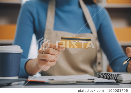 Business woman start up small business entrepreneur SME success .freelance woman working at home with Online Parcel delivery. SME and packaging deliveryconcept Business woman start up small business entrepreneur SME success .freelance woman working at home with Online Parcel delivery. SME and packaging deliveryconcept 109085796