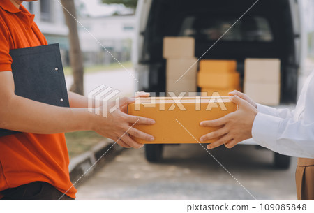 Asian Woman Receiving Product from delivery man at Home, Young Owner Woman Order Product from Smartphone Application, Woman with Online Business or SME Concept. 109085848