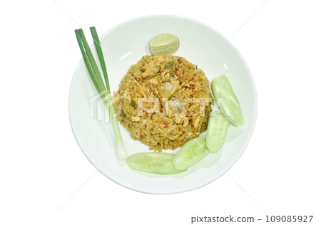 spicy fried rice clam in chili sauce with slice cucumber couple lemon on plate  109085927