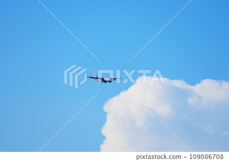 C-130 Hercules flying in the blue sky 109086708