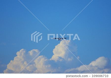 C-130 Hercules flying in the blue sky 109086710
