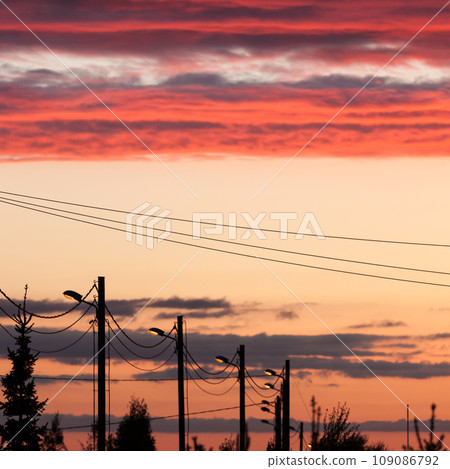 Electric line against colorful sky at sunset 109086792