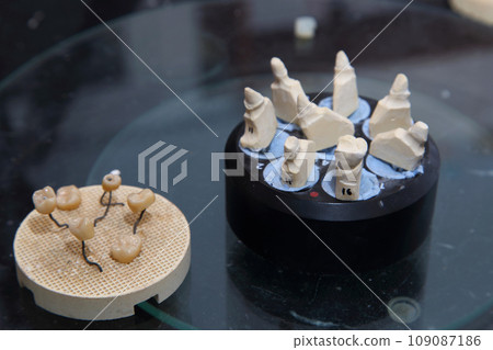 Fabrication of dental crowns and dentures made of ceramic. Scanning of plaster casts of teeth. Fabrication of ceramic dentures in a dental clinic. Ceramic dental crowns for implants. Fabrication of dental crowns and dentures made of ceramic. Scanning of plaster casts of teeth. Fabrication of ceramic dentures in a dental clinic. Ceramic dental crowns for implants. 109087186
