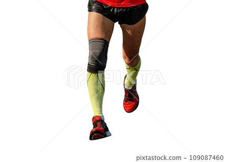 close-up legs male runner in compression socks and knee pads running marathon race, isolated on white background close-up legs male runner in compression socks and knee pads running marathon race, isolated on white background 109087460