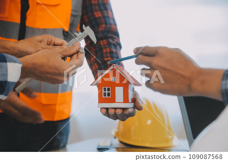Construction and structure concept of Engineer or architect meeting for project working with partner and engineering tools on model building and blueprint in working site, contract for both companies. Construction and structure concept of Engineer or architect meeting for project working with partner and engineering tools on model building and blueprint in working site, contract for both companies. 109087568