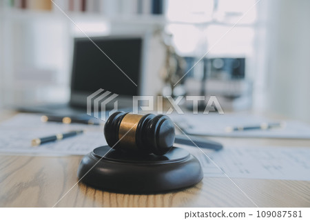 Consultation and conference of Male lawyers and professional businesswoman working and discussion having at law firm in office. Concepts of law, Judge gavel with scales of justice. 109087581