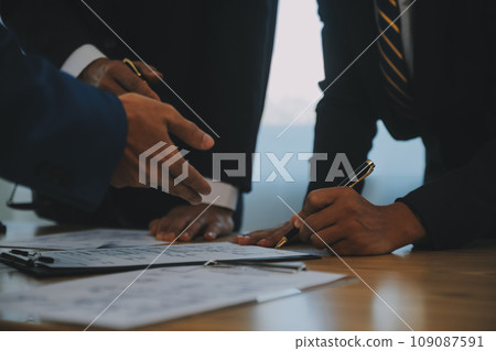 Consultation and conference of Male lawyers and professional businesswoman working and discussion having at law firm in office. Concepts of law, Judge gavel with scales of justice. 109087591