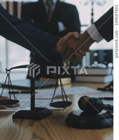 Consultation and conference of Male lawyers and professional businesswoman working and discussion having at law firm in office. Concepts of law, Judge gavel with scales of justice. 109087602