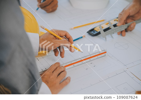 Construction and structure concept of Engineer or architect meeting for project working with partner and engineering tools on model building and blueprint in working site, contract for both companies. 109087624