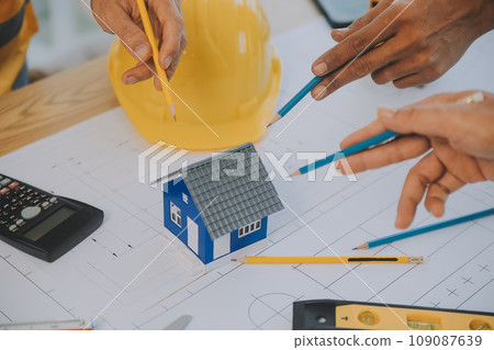 Construction and structure concept of Engineer or architect meeting for project working with partner and engineering tools on model building and blueprint in working site, contract for both companies. Construction and structure concept of Engineer or architect meeting for project working with partner and engineering tools on model building and blueprint in working site, contract for both companies. 109087639