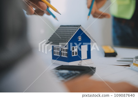 Construction and structure concept of Engineer or architect meeting for project working with partner and engineering tools on model building and blueprint in working site, contract for both companies. Construction and structure concept of Engineer or architect meeting for project working with partner and engineering tools on model building and blueprint in working site, contract for both companies. 109087640