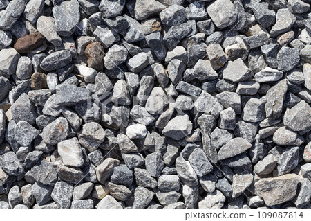 Crushed grey stones 109087814