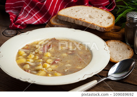 Sour soup on a plate. 109089692