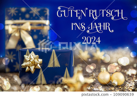 Text Guten Rutsch 2024, Means Happy 2024, Golden And Blue Christmas Decoration Text Guten Rutsch 2024, Means Happy 2024, Golden And Blue Christmas Decoration 109090639