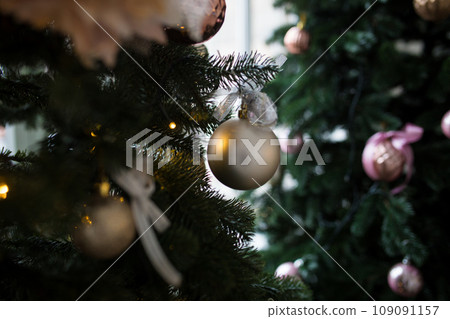 New Year tree with different toys and balls. Christmas lights and toys. New Year tree with different toys and balls. Christmas lights and toys. 109091157