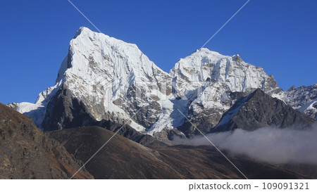 Snow covered mountains Cholatse and Tobuche, Nepal. Snow covered mountains Cholatse and Tobuche, Nepal. 109091321