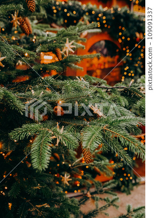 Christmas fir tree decorations with red and gold baubles. New Year celebration concept Christmas fir tree decorations with red and gold baubles. New Year celebration concept 109091337