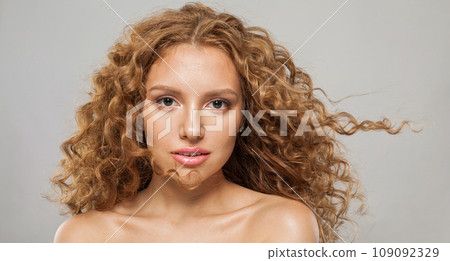 Magnificient wavy hair woman. Young fashion model with long curly hairstyle Magnificient wavy hair woman. Young fashion model with long curly hairstyle 109092329