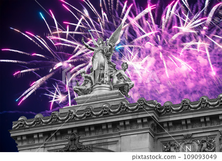 Fireworks over the Golden statue of Liberty on the roof of the Opera Garnier (Garnier Palace). Sculpted by Charles Gumery in 1869. Paris, France. UNESCO World Heritage Site Fireworks over the Golden statue of Liberty on the roof of the Opera Garnier (Garnier Palace). Sculpted by Charles Gumery in 1869. Paris, France. UNESCO World Heritage Site 109093049