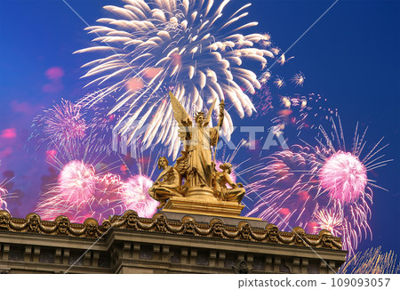 Fireworks over the Golden statue of Liberty on the roof of the Opera Garnier (Garnier Palace). Sculpted by Charles Gumery in 1869. Paris, France. UNESCO World Heritage Site Fireworks over the Golden statue of Liberty on the roof of the Opera Garnier (Garnier Palace). Sculpted by Charles Gumery in 1869. Paris, France. UNESCO World Heritage Site 109093057