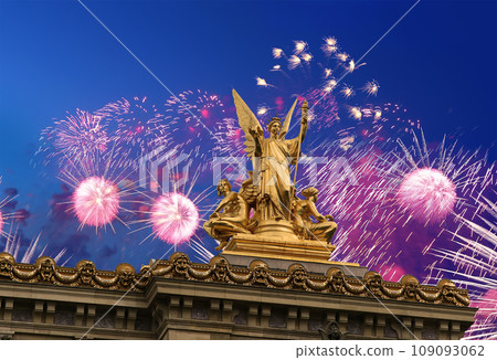 Fireworks over the Golden statue of Liberty on the roof of the Opera Garnier (Garnier Palace). Sculpted by Charles Gumery in 1869. Paris, France. UNESCO World Heritage Site 109093062