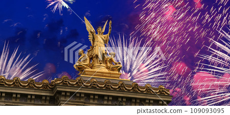 Fireworks over the Golden statue of Liberty on the roof of the Opera Garnier (Garnier Palace). Sculpted by Charles Gumery in 1869. Paris, France. UNESCO World Heritage Site Fireworks over the Golden statue of Liberty on the roof of the Opera Garnier (Garnier Palace). Sculpted by Charles Gumery in 1869. Paris, France. UNESCO World Heritage Site 109093095