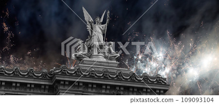 Fireworks over the Golden statue of Liberty on the roof of the Opera Garnier (Garnier Palace). Sculpted by Charles Gumery in 1869. Paris, France. UNESCO World Heritage Site 109093104