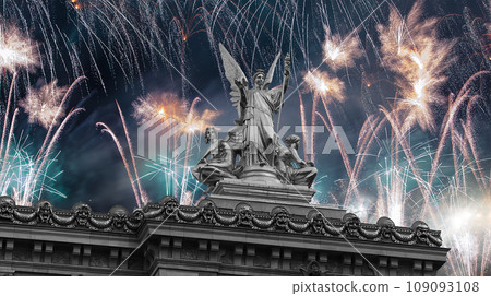 Fireworks over the Golden statue of Liberty on the roof of the Opera Garnier (Garnier Palace). Sculpted by Charles Gumery in 1869. Paris, France. UNESCO World Heritage Site 109093108