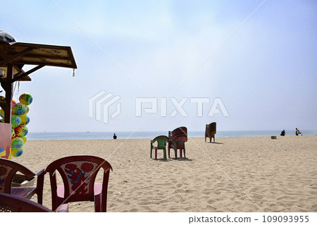 Scene of beach life with beach chair on the beach on Indian subcontinent on a Sunny day at renowned seashore of Puri, Odisha, India,Asia. 12th February 2020. 109093955
