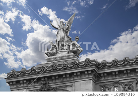 Golden statue of Liberty on the roof of the Opera Garnier (Garnier Palace) against the sky with clouds. Sculpted by Charles Gumery in 1869. Paris, France. UNESCO World Heritage Site Golden statue of Liberty on the roof of the Opera Garnier (Garnier Palace) against the sky with clouds. Sculpted by Charles Gumery in 1869. Paris, France. UNESCO World Heritage Site 109094310