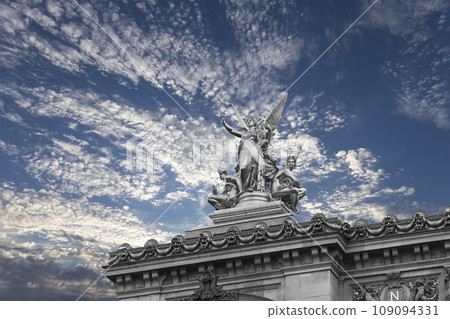 Golden statue of Liberty on the roof of the Opera Garnier (Garnier Palace) against the sky with clouds. Sculpted by Charles Gumery in 1869. Paris, France. UNESCO World Heritage Site Golden statue of Liberty on the roof of the Opera Garnier (Garnier Palace) against the sky with clouds. Sculpted by Charles Gumery in 1869. Paris, France. UNESCO World Heritage Site 109094331