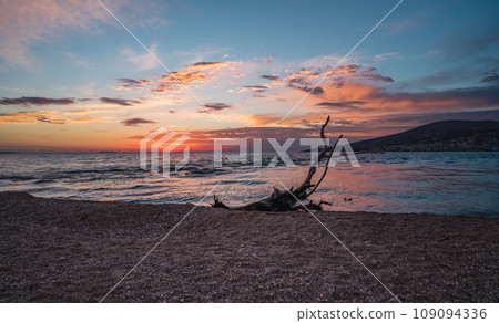 Sarande beach during sunset. Bistrica Beach with view at Sarande city. beautiful evening sky Sarande beach during sunset. Bistrica Beach with view at Sarande city. beautiful evening sky 109094336