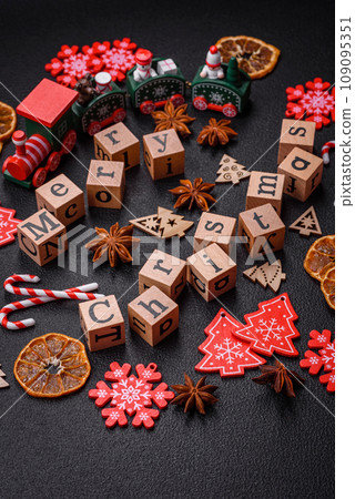 Beautiful Christmas composition with copy space with an inscription in wooden cubes Beautiful Christmas composition with copy space with an inscription in wooden cubes 109095351