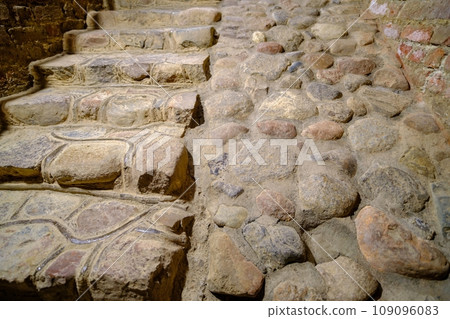 Stone texture, massive cobble stone mountain path with steps 109096083