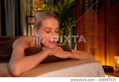 Caucasian woman customer enjoying relaxing anti-stress massage. Quiescent 109097335