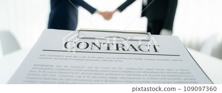 Two business executive shake hand in boardroom for merger and acquisition. Shrewd Two business executive shake hand in boardroom for merger and acquisition. Shrewd 109097360