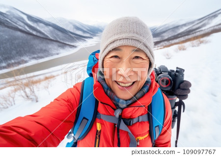 Traveler influencer taking selfie during travel in winter season comeliness Traveler influencer taking selfie during travel in winter season comeliness 109097767
