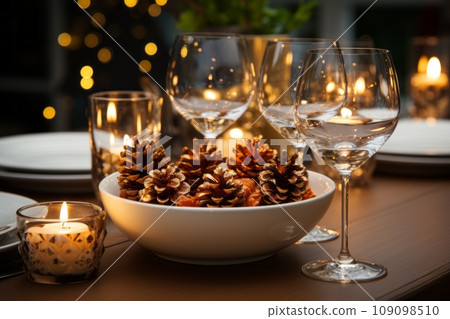 A dining table set for Christmas with a minimalist approach, showcasing plain white crockery, simple glassware, a few pine cones, and a single strand of twinkling lights or a slender candle 109098510