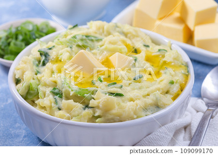 Delicious homemade Irish dish Colcannon or mashed potato with green cabbage, horizontal closeup 109099170